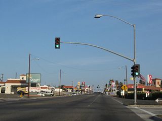 The off-ramp from I-15 south at Exit 184 intersects E Main Street across from Roberta Street, a north side frontage road for the freeway.