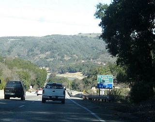 After Hebard Road, California 17 north opens up again as the tree canopy lessens. The next interchange is Exit 17, which connects to Old Santa Cruz Highway south, Bear Creek Road west, Montevina Road north, and Black Road west. The "Old Santa Cruz Highway" sign is located where Old Santa Cruz Highway used to connect to California 17, prior to the Bear Creek Road interchange being constructed.