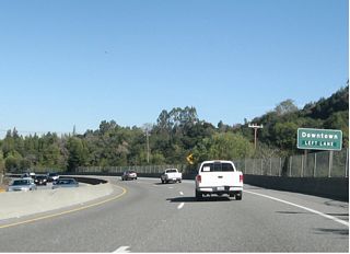 Use the left lane to connect to Exit 19, Santa Cruz Avenue north to Main Street east into the downtown section of the town of Los Gatos. The only legal difference in California between a "town" and a "city" is the word used in the town or city charter, and Los Gatos is described as a town in its town charter. (Many thanks to David Friedland for this information.)