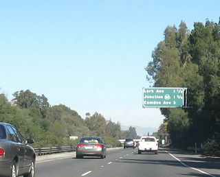 Continuing north, the next three exits along California 17 north are Exit 21, Lark Avenue, one and one-quarter miles; Exit 22, California 85 (West Valley Freeway); and Exit 23, Camden Avenue and Santa Clara County G-4 (San Tomas Expressway).