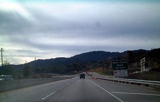 Southbound California 17 approaching Bear Creek Road, around Milepost 16. Note the substandard signage for this exit.