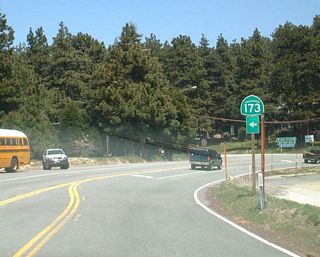 Eastbound California 18 approaching California 173. California 173 arcs north and then west from this point, passing along the east shore of private Lake Arrowhead and then west, via the only gravel road in the California state route system, to the Mojave River Forks Regional Park and a back way to Deep Creek Hot Springs. California 173 ends at its junction with California 138 near Silverwood Lake.