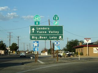 Eastbound California 18 meets Old Woman Springs Road at this intersection. Old Woman Springs Road connects to California 247 at a four-way stop just a couple hundred yards east of here in Lucerne Valley. At that four-way stop intersection, motorists can turn left for California 247/Barstow Road north to Barstow (34 miles) or proceed ahead for California 247/Old Woman Springs Road southeast to Landers, Yucca Valley, and California 62 (34 miles). Through traffic along California 18 south should aim right at this intersection.
