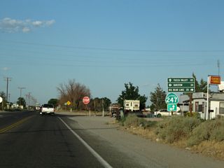 Eastbound Old Woman Springs Road meets California 247 at a four-way stop in Lucerne Valley. Turn left for California 247/Barstow Road north to Barstow (34 miles) or proceed ahead for California 247/Old Woman Springs Road southeast to Landers, Yucca Valley, and California 62 (34 miles). Turn right here for Barstow Road south to California 18 south to Big Bear Lake (25 miles).