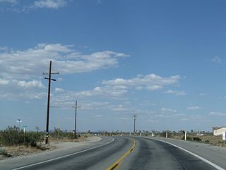 California 18 (Palmdale Road) continues east en route to Victorville. This section of the Mojave Desert is sparsely populated but does see some homesteads and ranches as the two-lane highway proceeds along its trek.