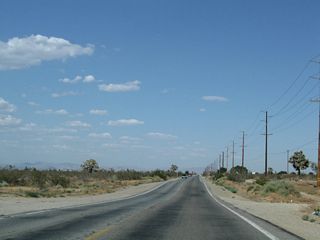 East of Johnson Road, California 18 (Palmdale Road) proceeds through the mostly undeveloped Mojave Desert. Joshua trees, a common plant found in the Mojave Desert, become more common as California 18 proceeds east and gradually loses elevation en route to Victorville.