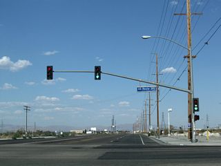 Turn right here for U.S. 395 south to Interstate 15 south en route to San Bernardino and San Diego. Turn left here for U.S. 395 north to downtown Adelanto, Ridgecrest, Independence, Bishop, and Reno. Ahead, California 18 will travel seven miles toward Victorville.
