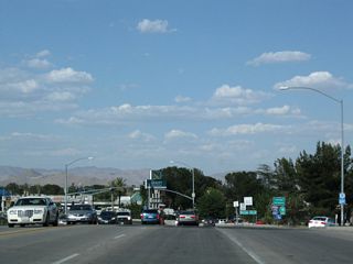 Eastbound California 18 departs from Palmdale Boulevard onto Interstate 15 north (right exit). The left two lanes of Palmdale Bouelvard continue ahead into downtown Victorville and becomes designated as Business Loop I-15 and Historic U.S. 66-91.