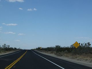 Due to its location on the northern edge of the San Gabriel Mountains and wide washes that can bring floodwaters downhill from the mountains, California 18 can see the possibility of flash flooding, especially in summer with the possibility of heavy localized monsoonal thunderstorms.