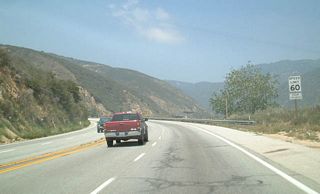 From its beginning at California 210, northbound California 18 ascends toward Lake Arrowhead and Big Bear Lake along a four-lane highway. These pictures show the road along northbound at varying intervals as it approaches California 138.  The speed limit generally remains 60 miles per hour on the entire northbound trek, with some exceptions. In some spots along the way, bridges were constructed to make California 18 four lanes. After the California 138 interchange, California 18 becomes a two-lane rural highway.