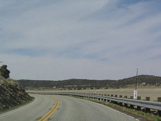 The highway skirts the southern shore of the ancient lake, and the dry lake bed is clearly visible.
