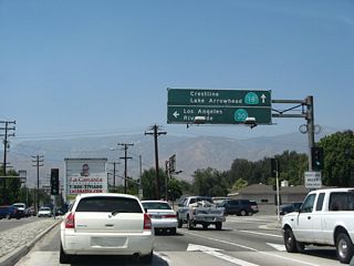 California 18 currently begins at the interchange between California 210 (Foothill Freeway) and Waterman Avenue in San Bernardino. At the time this photo was taken, California 210 was still signed as California 30; this has since been changed to California 210. The Waterman Avenue interchange marks the southern terminus of California 18; the legislative state Streets and Highways Code call for an extension of California 18 south along Waterman Avenue (potentially as a freeway) to Interstate 10, but no plans exist for constructing the extended state route.
