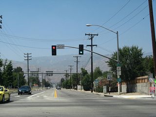 After crossing over California 210, northbound California 18 meets 30th Street. Turn left here for California 210 west to Interstate 215. Continue straight ahead for California 18 north to Crestline, Lake Arrowhead, and mountain resorts above San Bernardino.