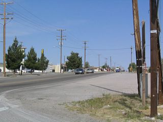 This photo looks north along the highway that links California 18 with California 247 as seen from the stop sign along northbound California 18. As promised, California 18 changes directions again, this time heading west toward Apple Valley and Victorville.