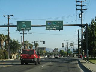 Southbound California 18/Waterman Avenue approaches the junction with California 210 (Foothill Freeway). Turn right on 30th Street to California 210 (former California 30) west to Interstate 215. The second left connects to California 210 east to Redlands.