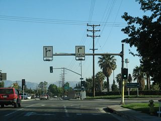 A pair of lane allocation shields is posted overhead at the 30th Street and California 210 west intersection.