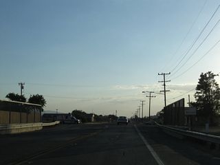 California 18 proceeds west through Lucerne Valley after the California 247 "bump" intersection. Due to the miles of open desert land ahead, California 18 motorists must use daytime headlights between Lucerne Valley and Apple Valley.