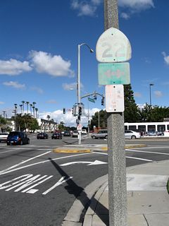 A rather old California 22 trailblazer is posted on Bellflower Boulevard north as it approaches the intersection with Seventh Street in Long Beach.