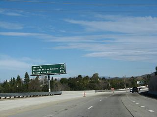This interchange sequence sign provides the distance to the first three exits along California 23 (Moorpark Freeway) north: Exit 14, Janss Road; Exit 15, Avenida de los Arboles; and Exit 16, Sunset Hills Boulevard.
