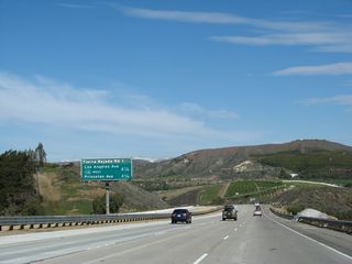This interchange sequence sign provides the distance to the next three exits along California 23 (Moorpark Freeway) north: Exit 19, Tierra Rejada Road and Exits 20A-B, California 118 (Los Angeles Avenue) and Simi Valley Freeway (Ronald Reagan Freeway). Also included is Princeton Avenue, which can be accessed via California 118 east after California 23 departs at Los Angeles Avenue.