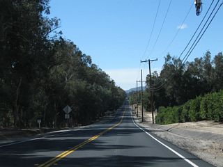 Northbound California 23 actually travels due west along Broadway Road. At the western end, where California 23 curves north onto Grimes Canyon Road, a set of Southern California Edison high-voltage power lines pass overhead.