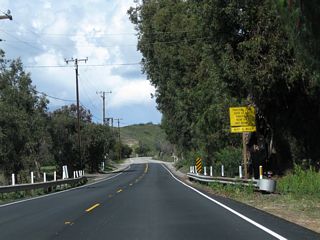 Two-lane California 23 leaves the agricultural area ahead of the descent into Grimes Canyon. While making several curves along this section of highway, these are gentle as compared to the switchbacks further ahead.