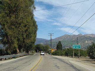 California 23 makes a 90-degree turn to the east, leaving Grimes Canyon Road and shifting onto Bellevue Avenue. Bardsdale Avenue west heads into agricultural and ranch lands.