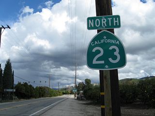 A California 23 north reassurance shield is posted on Bellevue Avenue on the short segment between Grimes Canyon Road and Chambersburg Road (next left visible in the distance).