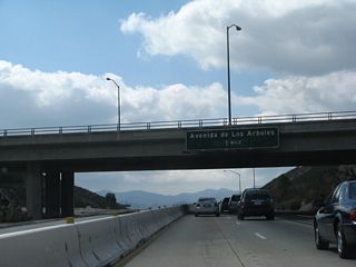 The next exit along California 23 (Moorpark Freeway) south is Exit 15, Avenida de los Arboles (Spanish for "Avenue of the Trees").
