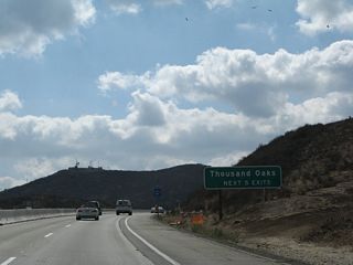 The next five exits from California 23 (Moorpark Freeway) south serve the city of Thousand Oaks: Exit 17, Olsen Road; Exit 16, Sunset Hills Boulevard; Exit 15, Avenida de los Arboles; Exit 14, Janss Road; and Exit 13, Hillcrest Drive and Thousand Oaks Boulevard.