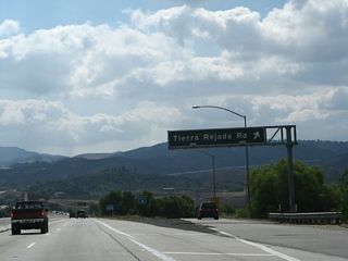 Southbound California 23 (Moorpark Freeway) reaches Exit 19, Tierra Rejada Road in the city of Moorpark. Construction was underway at the time this picture was taken to add a third lane to both directions of California 23. As a result, this sign has been replaced with a reflective guide sign with an exit number.