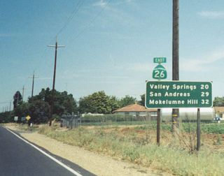 Distance sign posted 20 miles ahead of Valley Springs on SR 20 eastbound.
