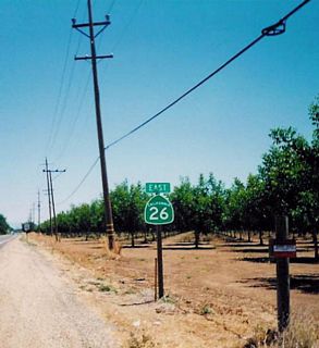 This view shows California 26 east in the Central Valley. California 26 passes through some prime agricultural real estate near the heart of the Central Valley.