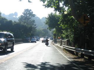 Northbound California 27 passes over an old bridge and enters the community of Topanga. The next major intersection is with Old Topanga Canyon Road, which offers an alternate route from Topanga north to U.S. 101.