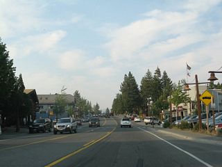 Eastbound California 28 passes through downtown Tahoe City. Although unincorporated, Tahoe City serves as one of the hubs of northern Lake Tahoe. Along with Kings Beach and Incline Village, Nevada, Tahoe City plays a role similar to the one South Lake Tahoe plays at the southern shore of the lake.