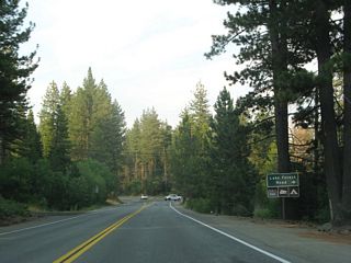 Soon thereafter, eastbound California 28 (North Lake Boulevard) approaches Lake Forest Road east. This side road loops back to California 28 a short distance northeast of here.