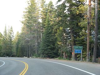 Eastbound California 28 enters the unincorporated community of Cedar Flat.