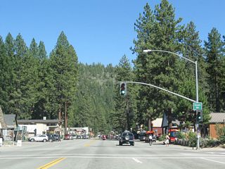 Eastbound California 28 (North Tahoe Boulevard) approaches Coon Street at this signalized intersection.  While California 28 is aptly named North Tahoe Boulevard, parallel streets north of here in Kings Beach are named after varieties of fish. For example, the next three east-west streets north of here are named Salmon Avenue, Brook Avenue, and Trout Avenue.