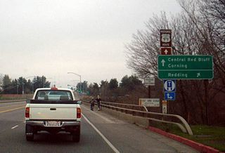 A historic U.S. 99 shield is posted along westbound California 36 as the highway enters metropolitan Red Bluff. Originally we thought Caltrans erected this sign, consdering that it's on a state route. However, Warren Jensen corrected us: "Historic 99 shields are paid for by community groups in our area, so thank the people of Red Bluff. Thanks, folks! Ironically, the section pictured was never part of U.S. 99. The original alignment was north of this point (the original bridges across these flood channels of the Sacramento are historic landmarks and are worth a side trip)."
