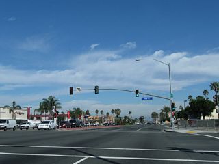 Within the city of Huntington Beach, northbound California 39 (Beach Boulevard) meets Heil Avenue at this traffic signal. A California 39 reassurance shield is posted on the mast arm of the traffic signal.