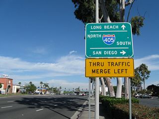 Northbound California 39 (Beach Boulevard) approaches its cloverleaf interchange with Interstate 405 (San Diego Freeway). The design of this interchange intended for direct connections with no stopping between all directions. The next intersection is with Edinger Avenue; turn right (east) on Edinger Avenue to the on-ramp for Interstate 405 south (east).