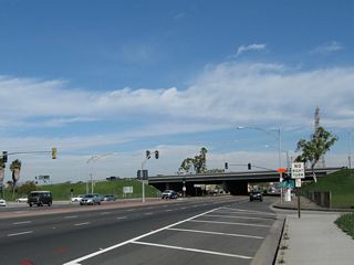 Entering the cloverleaf interchange, traffic from Interstate 405 south joins California 39 north at the merge visible here. Three through lanes carry California 39 north from Huntington Beach into Westminster.