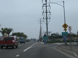 After passing under the Interstate 405 mainline, northbound California 39 (Beach Boulevard) meets the on-ramp to Interstate 405 (San Diego Freeway) north. A pair of freeway entrance shield assemblies flank the on-ramp. Ahead, California 39 proceeds north into Westminster. Photos taken 07/10/10