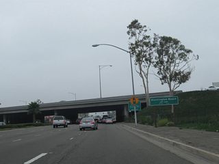 Some distance even further south, California 39 meets Interstate 405 at a cloverleaf interchange. At this point, California 39 leaves Westminster and enters the city of Huntington Beach, "Surf City USA." Huntington Beach had a population of 192,620 as of the 2000 Census and was incorporated on February 17, 1909. This city limits sign is posted immediately after the ramp from Interstate 405 north to California 39 south merges onto southbound Beach Boulevard.