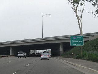 Prior to passing under the Interstate 405 mainline, a sign advises that the next intersection will be with Center Avenue. Turn right on Center Avenue to connect to Interstate 405 south to Irvine and San Diego.