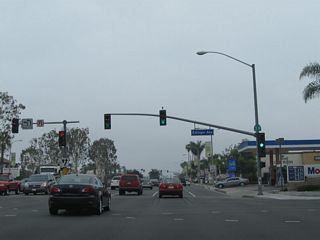 Leaving the Interstate 405 interchange and after the traffic signal with Center Avenue, southbound California 39 (Beach Boulevard) meets Edinger Avenue. A California 39 south reassurance shield is posted on the overhead mast arm.