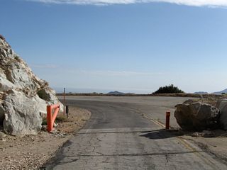 A gate blocks access from the open section of California 39 to the closed section.