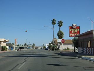 Broadway Street east at D Street by one of several businesses in Needles using Route 66 in its name.