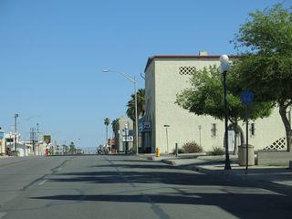 A County Route 66 reassurance marker stands along Broadway Street south ahead of F Street.