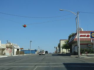 Business Loop I-40/Historic U.S. 66 (Broadway Street) east at the stop sign at G Street.